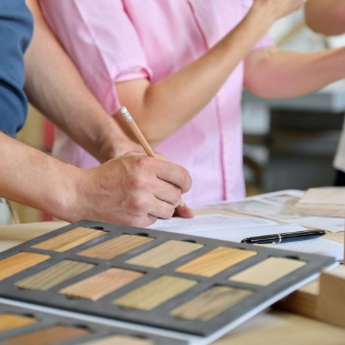 close-up-work-carpentry-furniture-workshop-hands-workers-wooden-furniture-palette